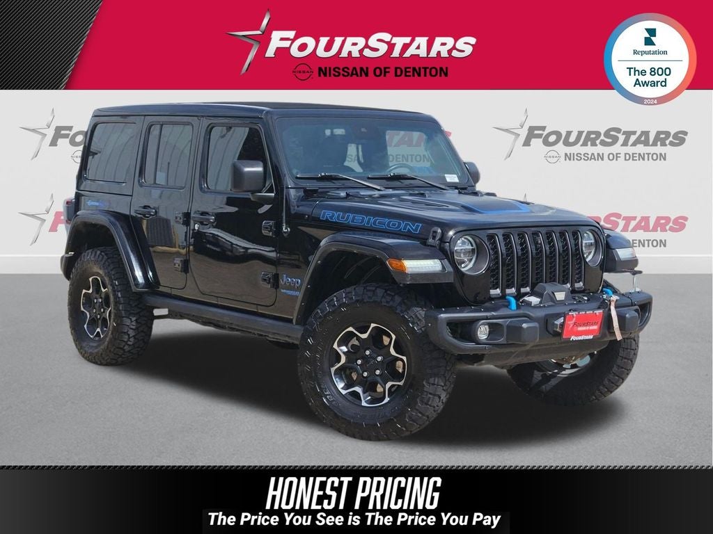 2021 Jeep Wrangler Unlimited Rubicon 4xe in Black Clearcoat — front three-quarter view