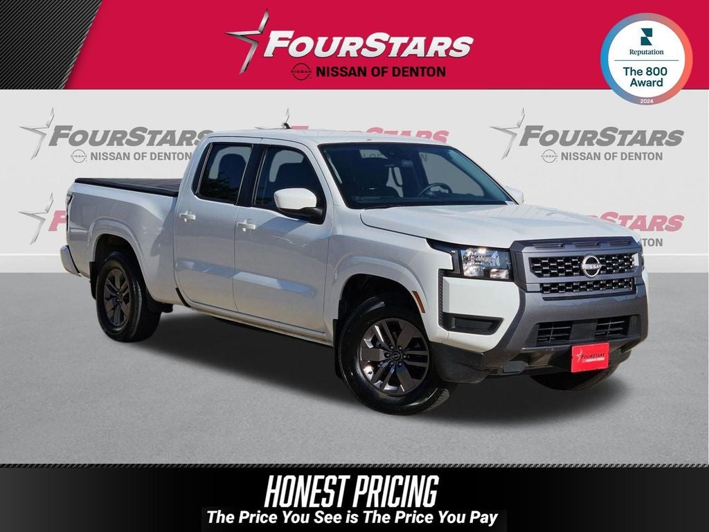 2025 Nissan Frontier SV in Glacier White — front three-quarter view