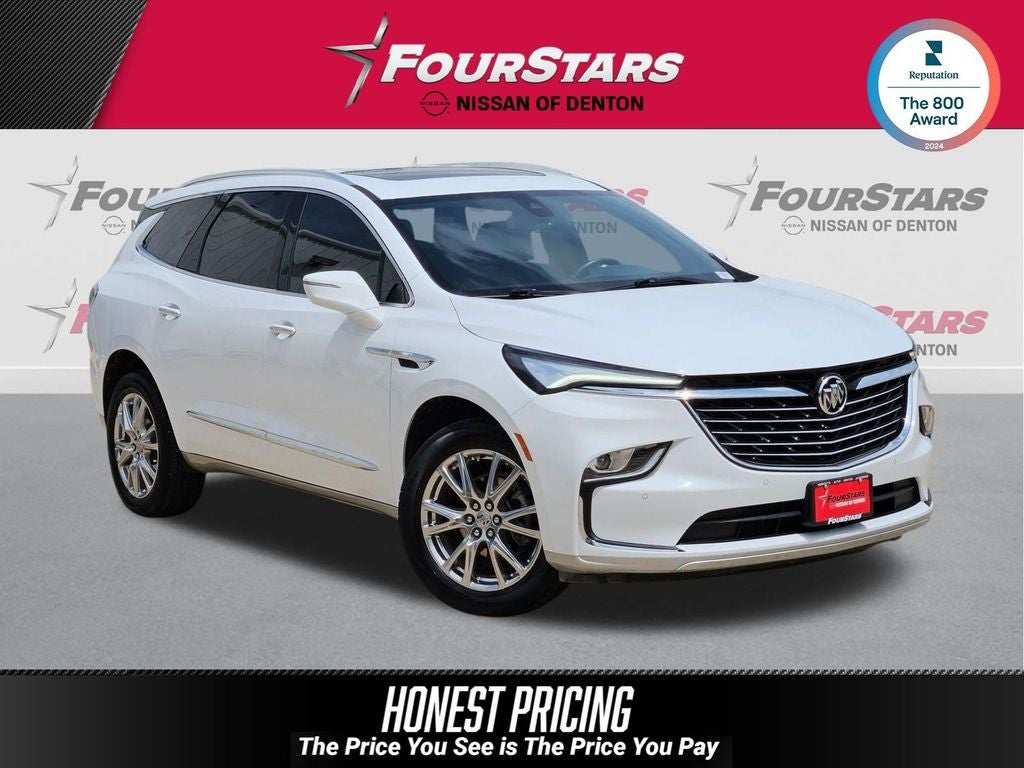 2023 Buick Enclave Essence in Summit White — front three-quarter view