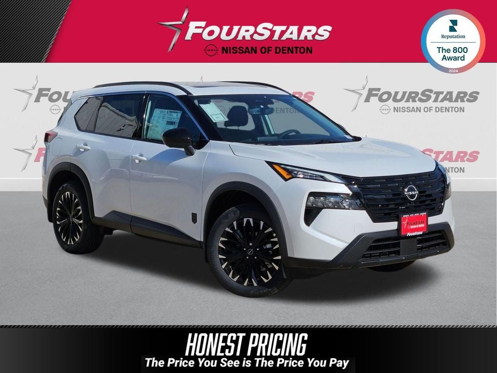 2026 Nissan Rogue Dark Armor in Everest White Pearl Tricoat — front three-quarter view