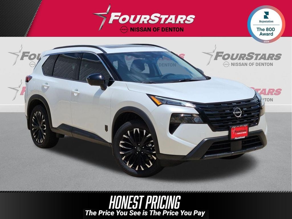 2026 Nissan Rogue Dark Armor in Everest White Pearl Tricoat — front three-quarter view
