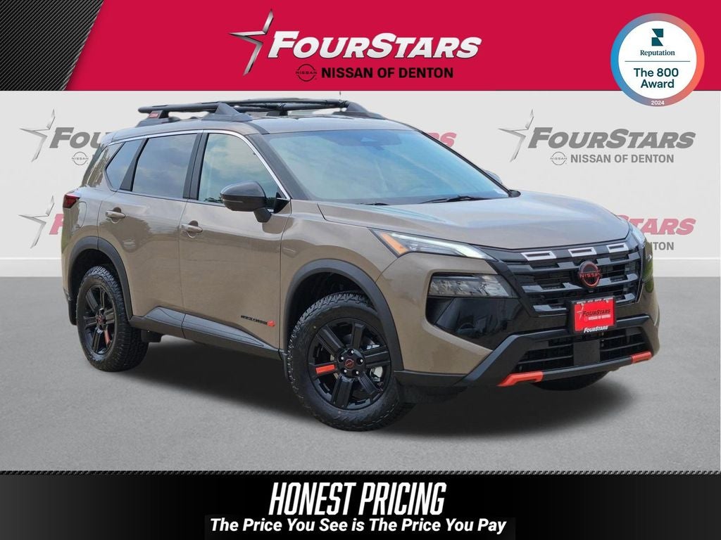 2026 Nissan Rogue Rock Creek in Baja Storm Metallic — front three-quarter view