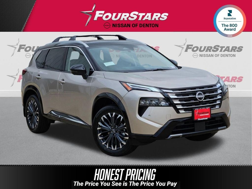 2026 Nissan Rogue Platinum in Champagne Silver/Black — front three-quarter view